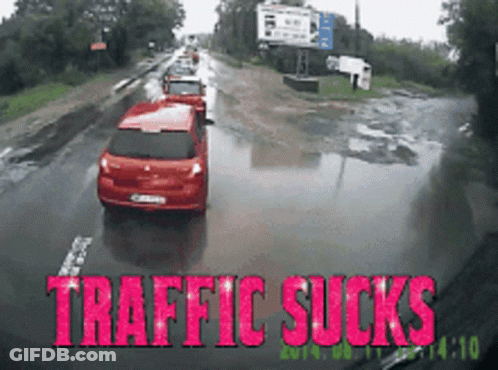 Red Car Driving On Wet Road Traffic Sucks GIF