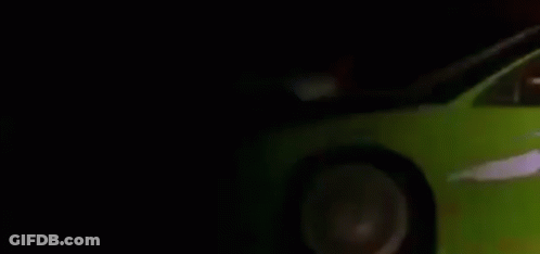 Red Car Driving Past White Car On Road GIF