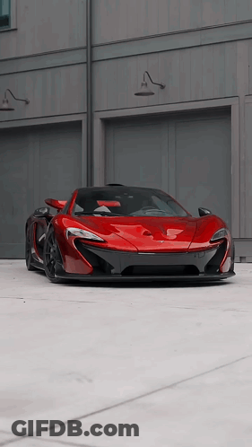 Red Car Parked In Front Of Garage GIF