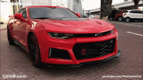 Red Car Parked In Front Of YouTube Channel GIF