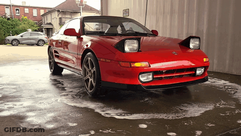 Red Car Parked Near No Parking Sign GIF