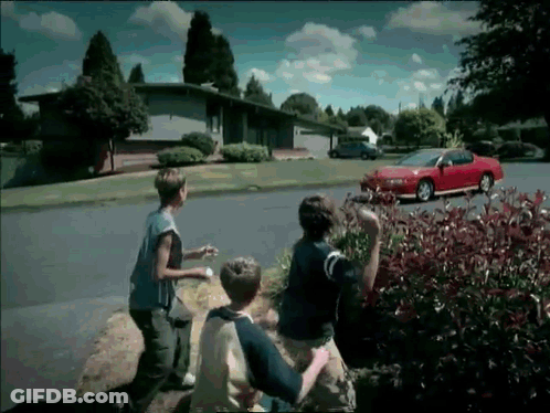 Red Car Parked On Residential Road GIF