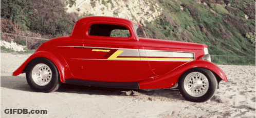 Red Car With Letter Z On Sandy Beach GIF