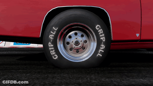 Red Car With Tire Saying Grip-All GIF