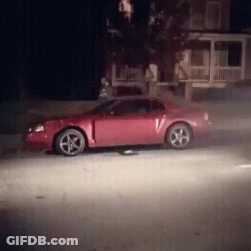 Red Car With V Driving At Night GIF