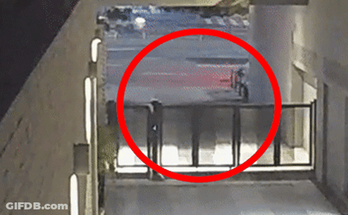 Red Circle Person Walking Through Fence GIF