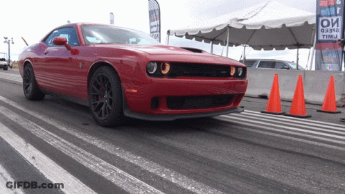 Red Dodge Challenger Driving On Track With Orange Cones GIF