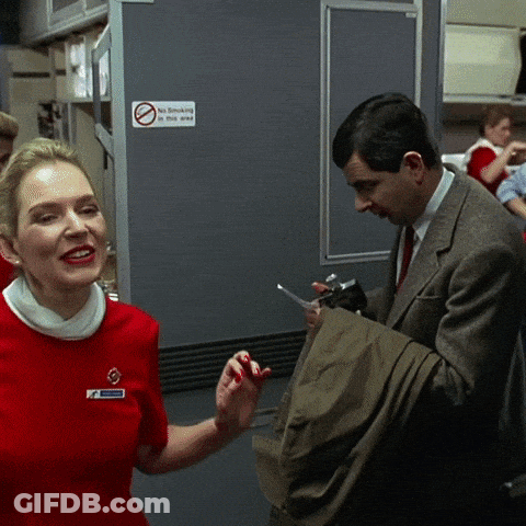 Red Dress Woman And Suit Man By No Smoking Sign GIF