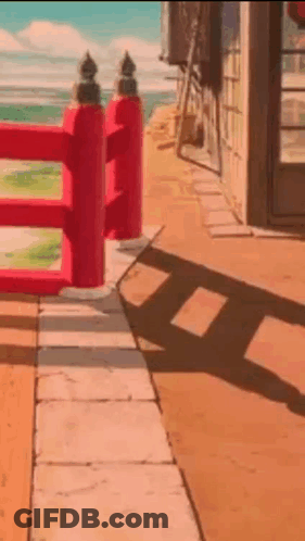 Red Fence On Sidewalk Beside Building GIF