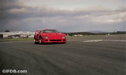 Red Ferrari F40 Driving On Cloudy Track GIF