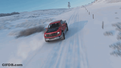 Red Ford Truck Drives Through Snow GIF
