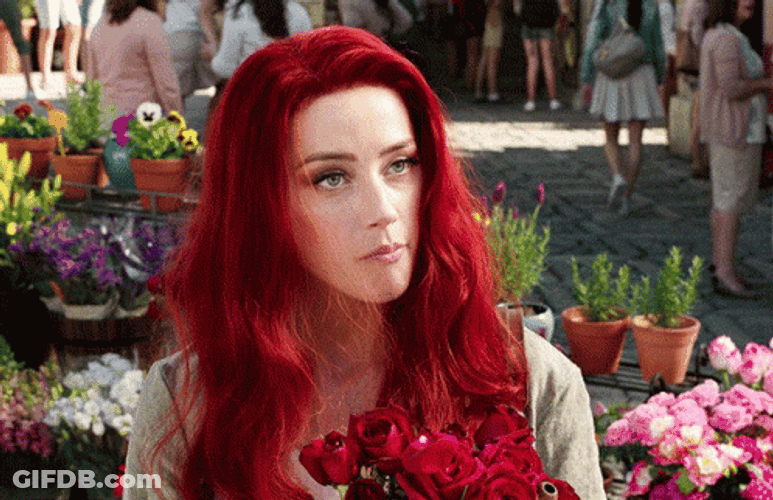 Red Hair Giving Flowers GIF