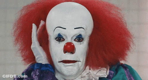 Red Hair Red Nose Clown Holding Hand To Head GIF