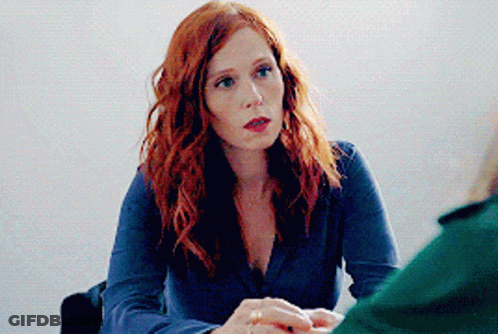 Red Hair Woman At Table With Another Woman GIF