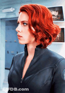 Red Hair Woman In Black Jacket Standing In Room GIF
