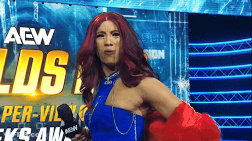 Red Hair Woman In Blue Dress Holding Microphone GIF