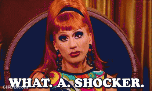 Red Hair Woman Sitting Saying What A Shocker GIF