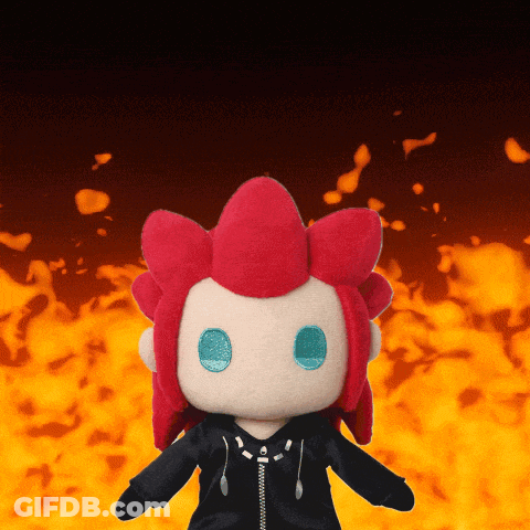 Red-Haired Blue-Eyed Stuffed Animal By Fire GIF