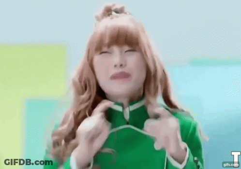 Red-Haired Girl In Green Jacket Funny Face GIF