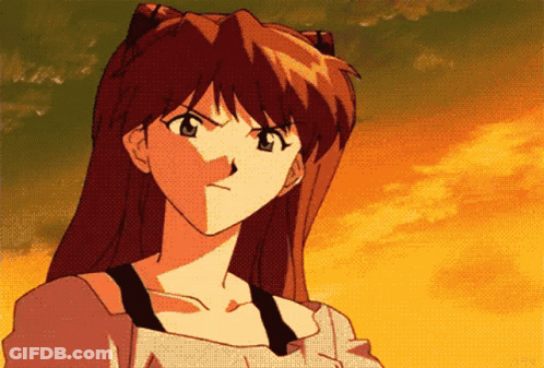 Red-Haired Girl Looking At Camera Seriously GIF