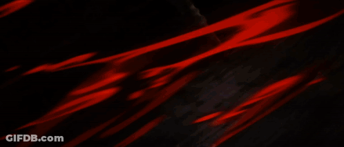 Red-Haired Girl With Black Tie In Dark Hallway GIF