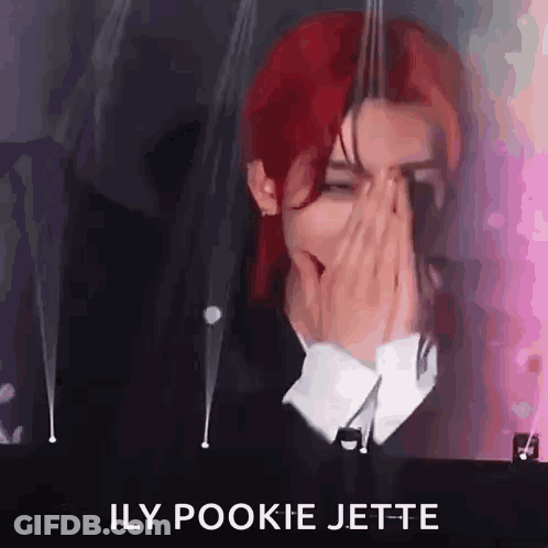 Red-Haired Man Covering Face At Microphone GIF