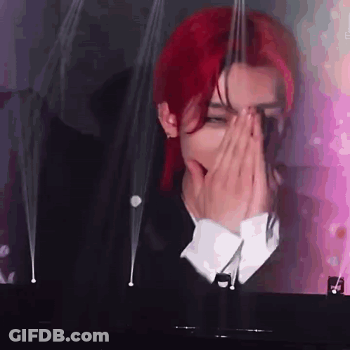 Red-Haired Man Covering Face At Piano GIF