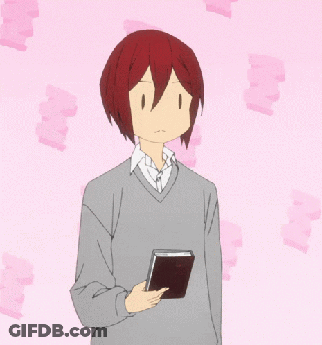 Red-Haired Man Holding Book GIF