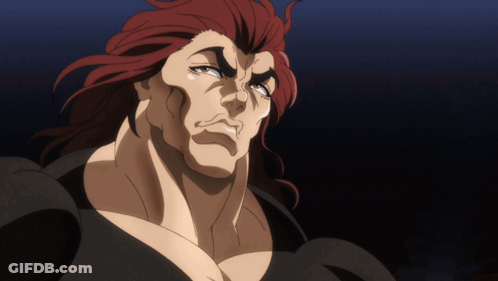 Red-Haired Man In Black Shirt Looking Down GIF