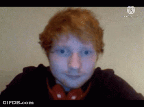 Red-Haired Man In Headphones And Black Shirt GIF