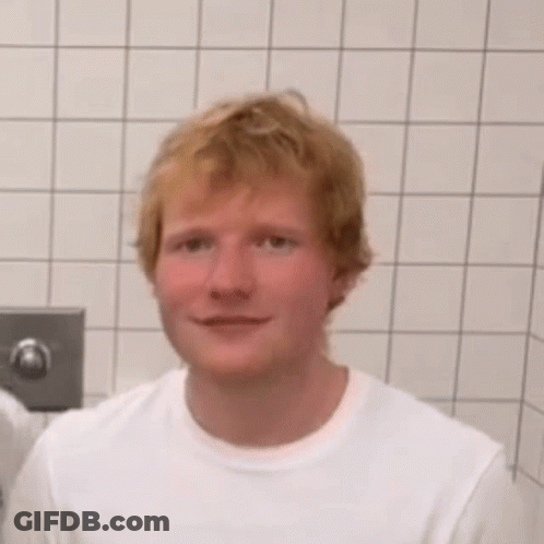 Red-Haired Man In White Shirt Bathroom Mouth Open GIF