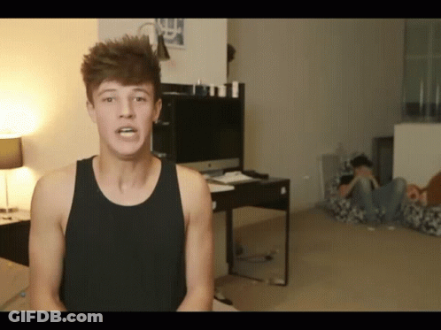 Red-Haired Man Making Funny Face At Microphone GIF