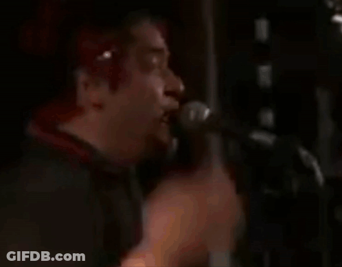 Red-Haired Man Singing Into Microphone GIF