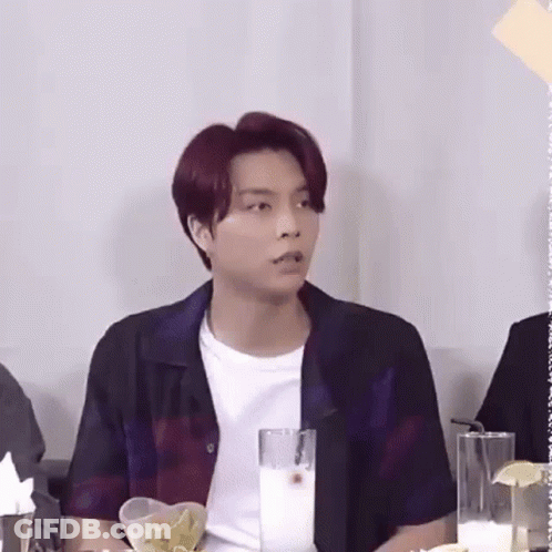 Red-Haired Man Sitting At Table With Milk And Chips GIF