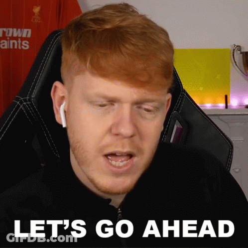 Red-Haired Man Sitting In Chair Saying Let's Go Ahead GIF