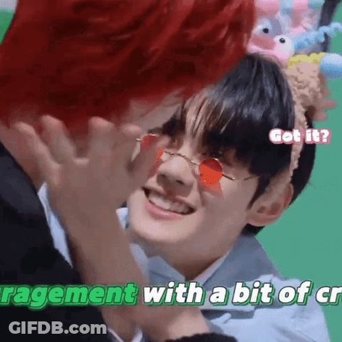 Red-Haired Man Touching Another's Face With Red Sunglasses And Headband GIF