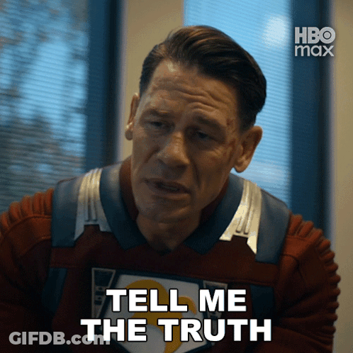 Red-Haired Man With Horn Looking At Camera GIF