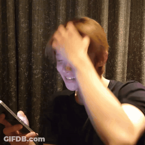Red Haired Person In Black Jacket GIF