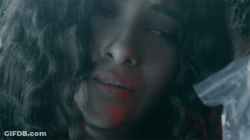 Red-Haired Woman Covering Face GIF