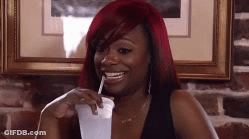 Red-Haired Woman Drinking With Straw GIF