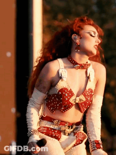 Red-Haired Woman Holding Microphone GIF