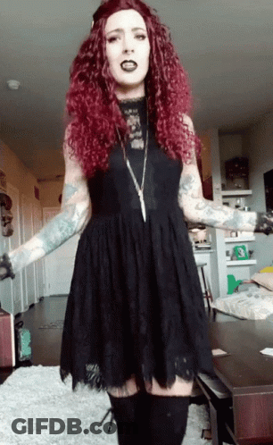 Red-Haired Woman In Black Dress And Boots GIF