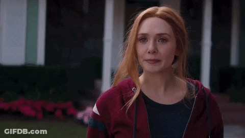 Red-Haired Woman In Red Hoodie And Black Shirt GIF