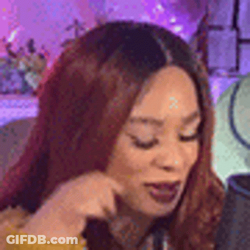 Red-Haired Woman Looking At Phone GIF