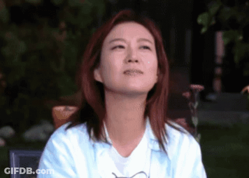 Red-Haired Woman Looking Up At Sky GIF