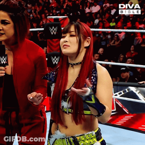 Red Haired Woman Next To Woman In Diva Bible Ad GIF
