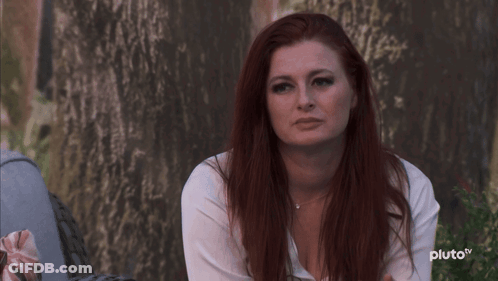 Red-Haired Woman Sitting By Tree Pluto TV GIF