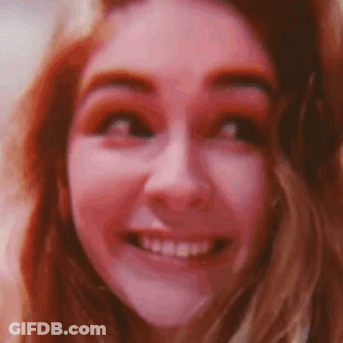 Red-Haired Woman Smiling At Camera GIF