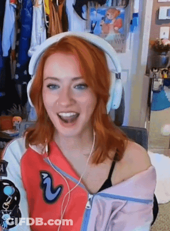 Red-Haired Woman Smiling In Headphones GIF