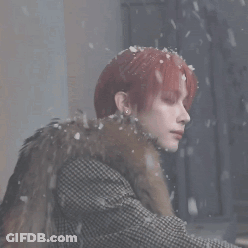 Red-Haired Woman Wearing Fur Coat In Snow GIF